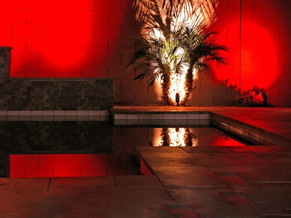 a photo showing a modern swimming pool. image has a red cast