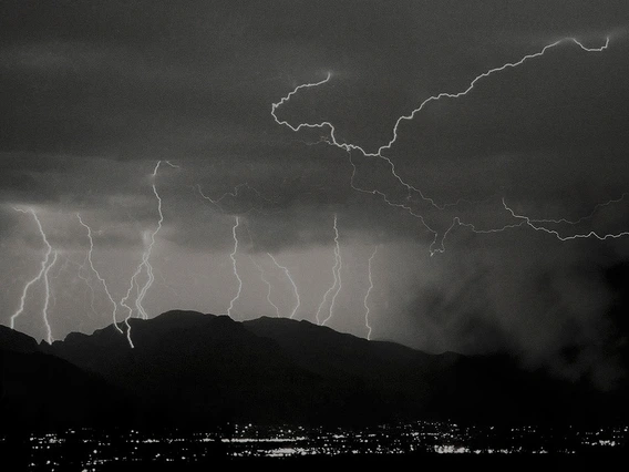 black and white photo showing multiple lightning bolts in Tucson