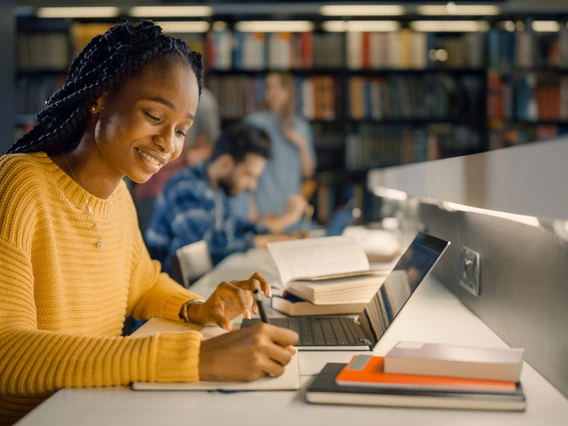 photo of a student at a laptop