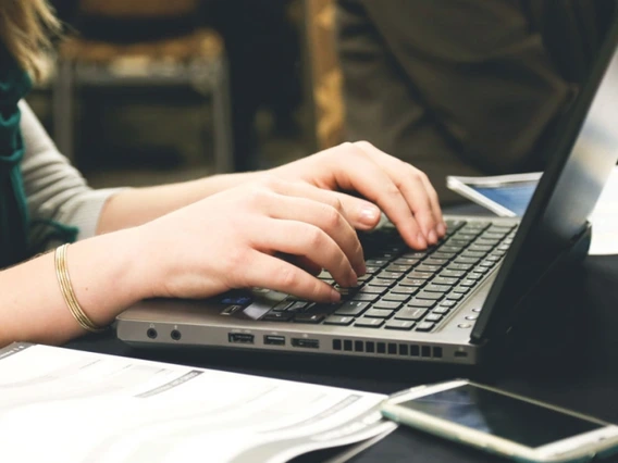 person typing at keyboard