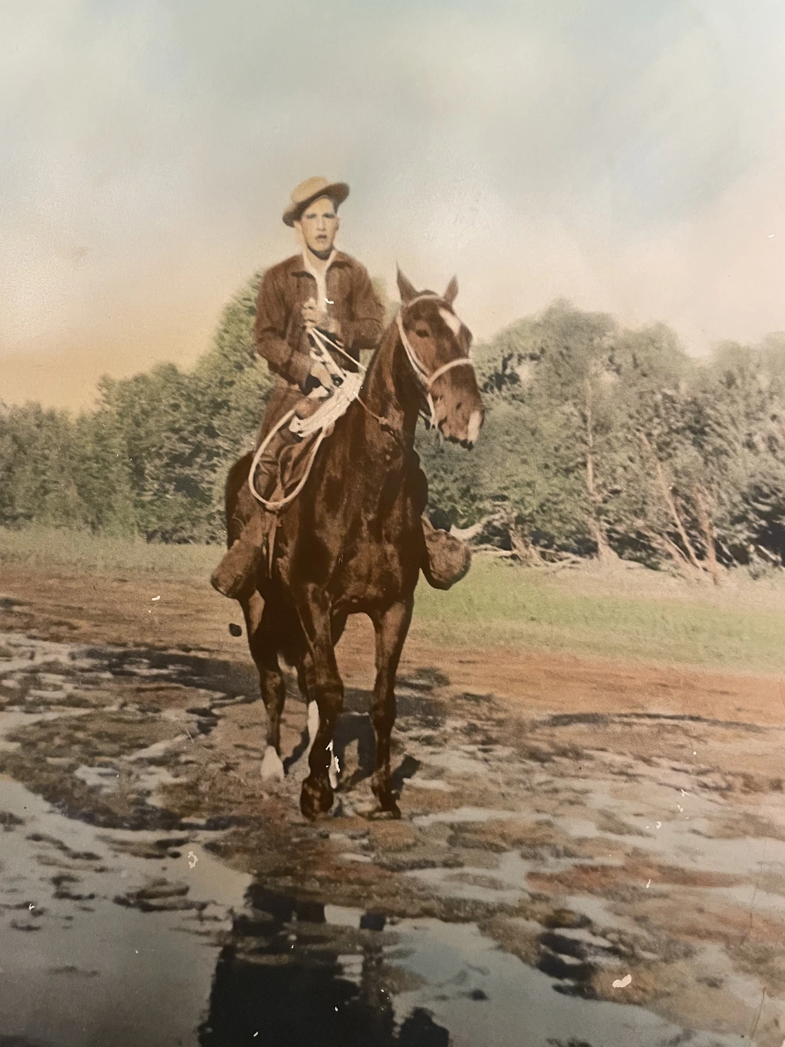 Cory Runyon; Grandfather Mike Martinez Jr. on horseback; Bill Williams River, AZ; 1940