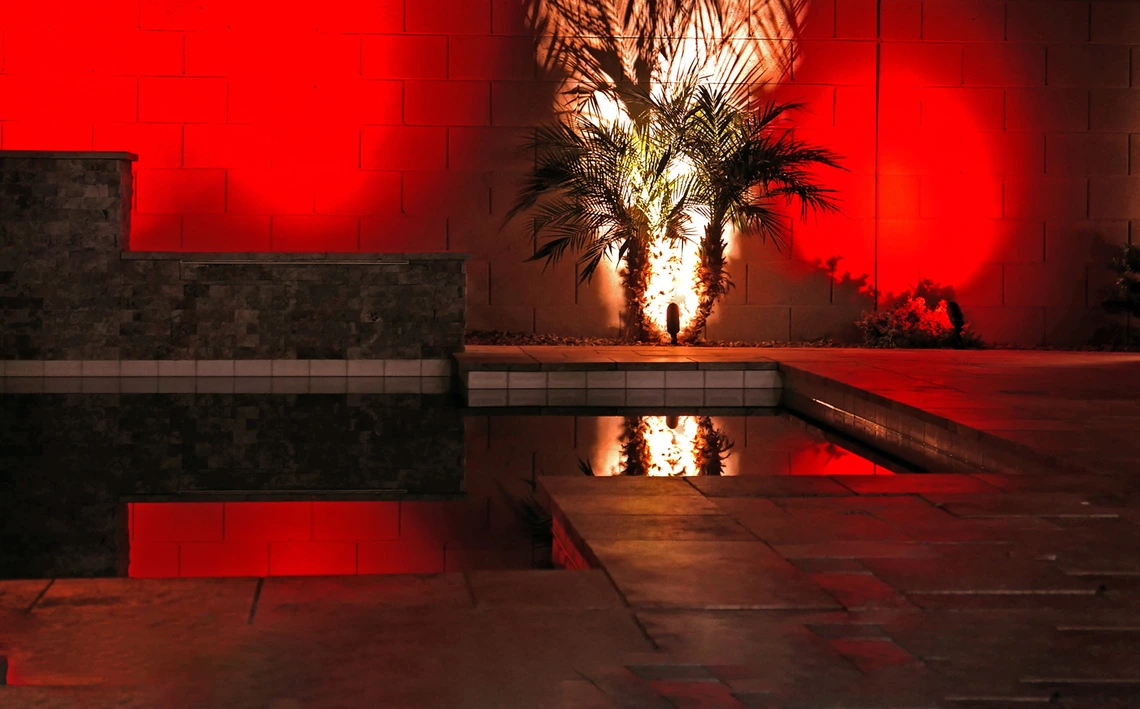 a photo showing a modern swimming pool. image has a red cast