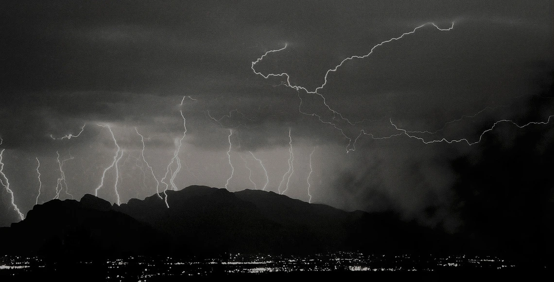 black and white photo showing multiple lightning bolts in Tucson