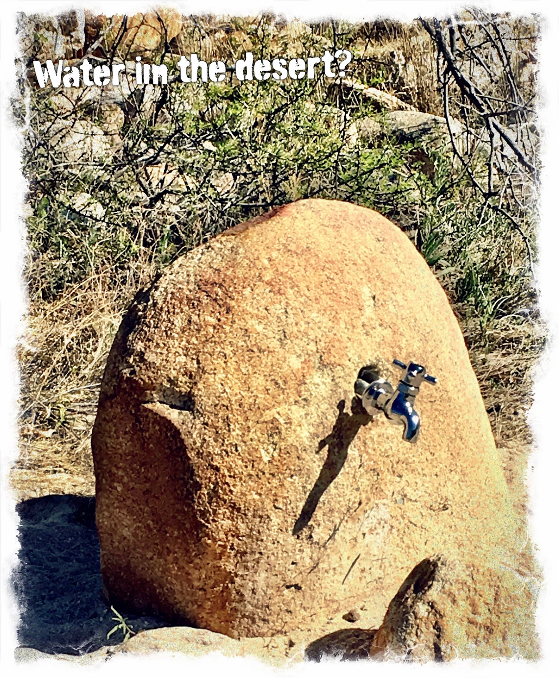 photo of a desert rock with a water spigot coming out of it