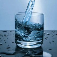 photo of water being poured into a glass