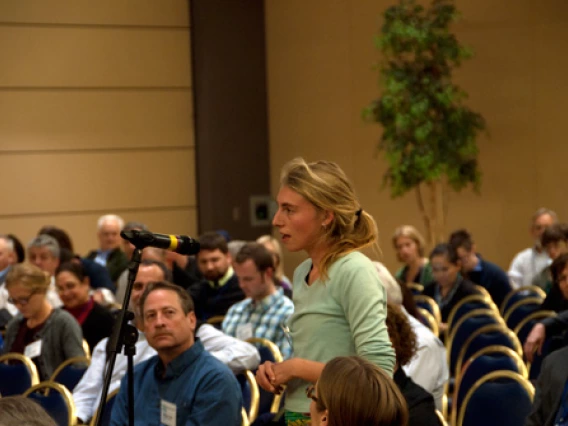 Student asks question of speakers