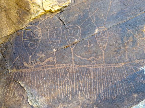 Peter Blystone photo showing Petroglyphs symbolizing rain carved on a  on a rock