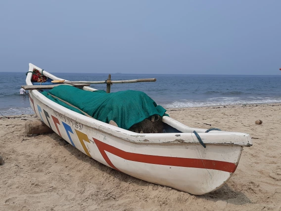 Channa Ganesh photo showing Devebag Beach with a boat on the edge