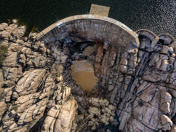 Joe Trevino photo showing an aerial view of Watson Lake Dam with rock formations near it