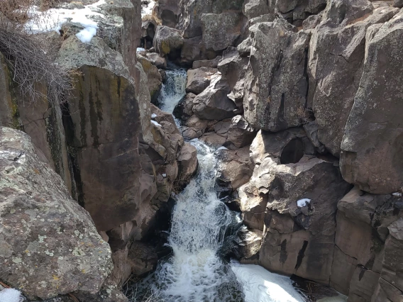 photo of a rocky canyon with a small waterfall