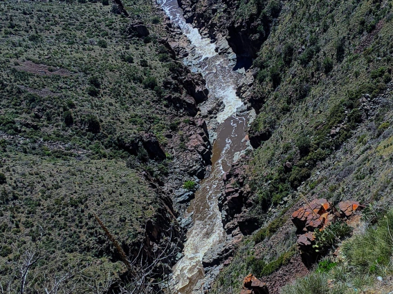 photo of a river cutting through a mountain valley