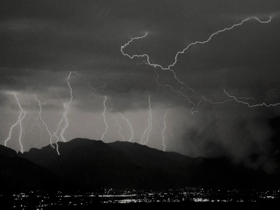 black and white photo showing multiple lightning bolts in Tucson