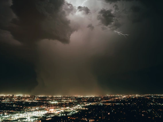 night photo of phoenix cityscape showing lightning storm 