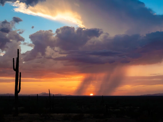 photo showing sunset with rainclouds