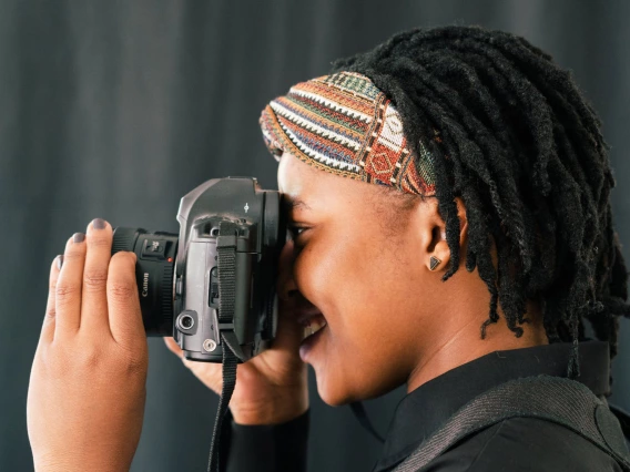 An individual focusing a camera