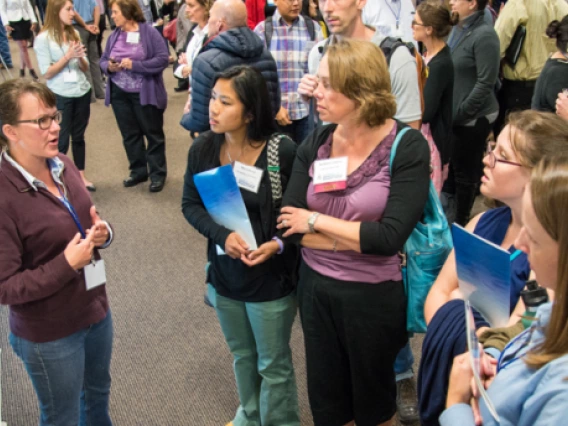 students looking at a poster