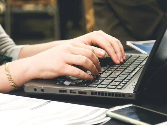 woman at keyboard typing