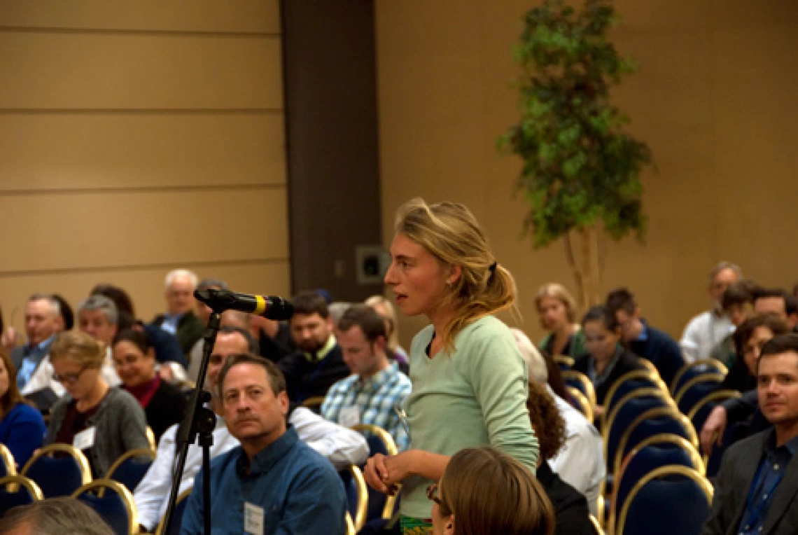 Student asks question of speakers