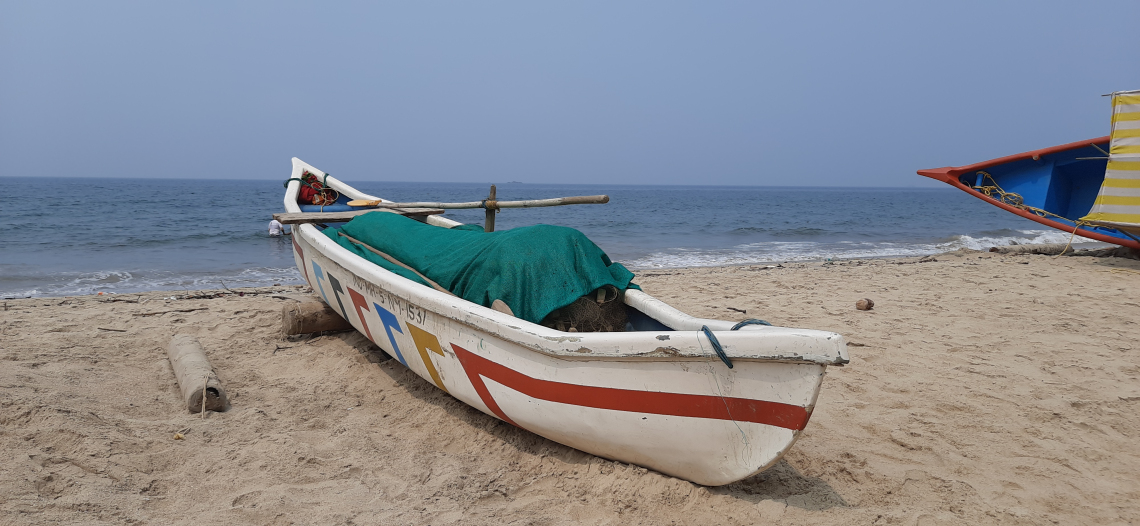 Channa Ganesh photo showing Devebag Beach with a boat on the edge
