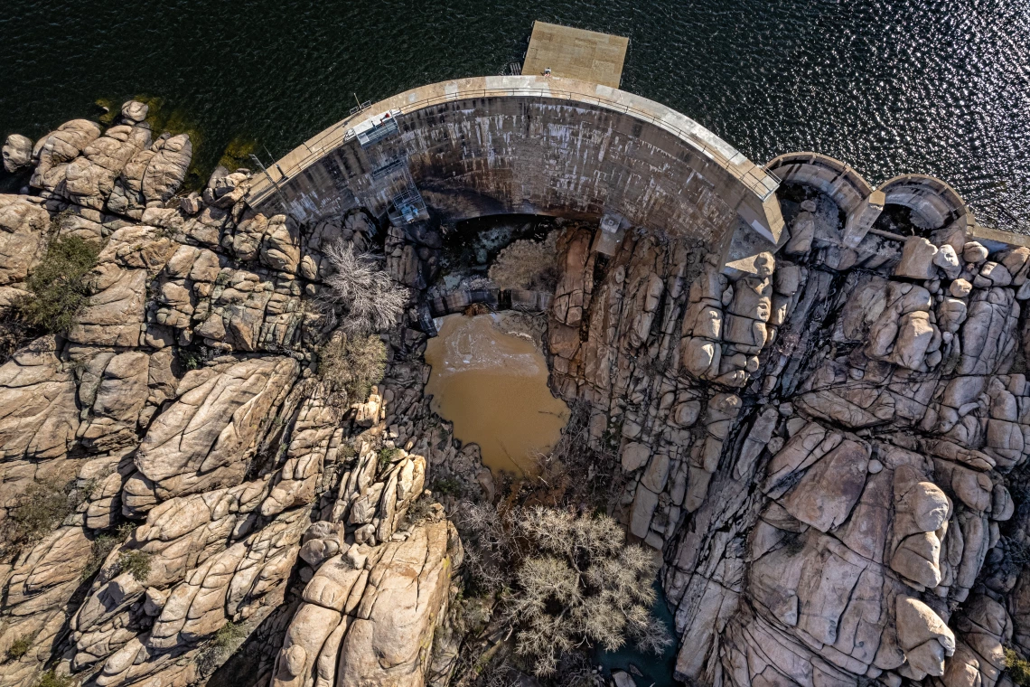 Joe Trevino photo showing an aerial view of Watson Lake Dam with rock formations near it