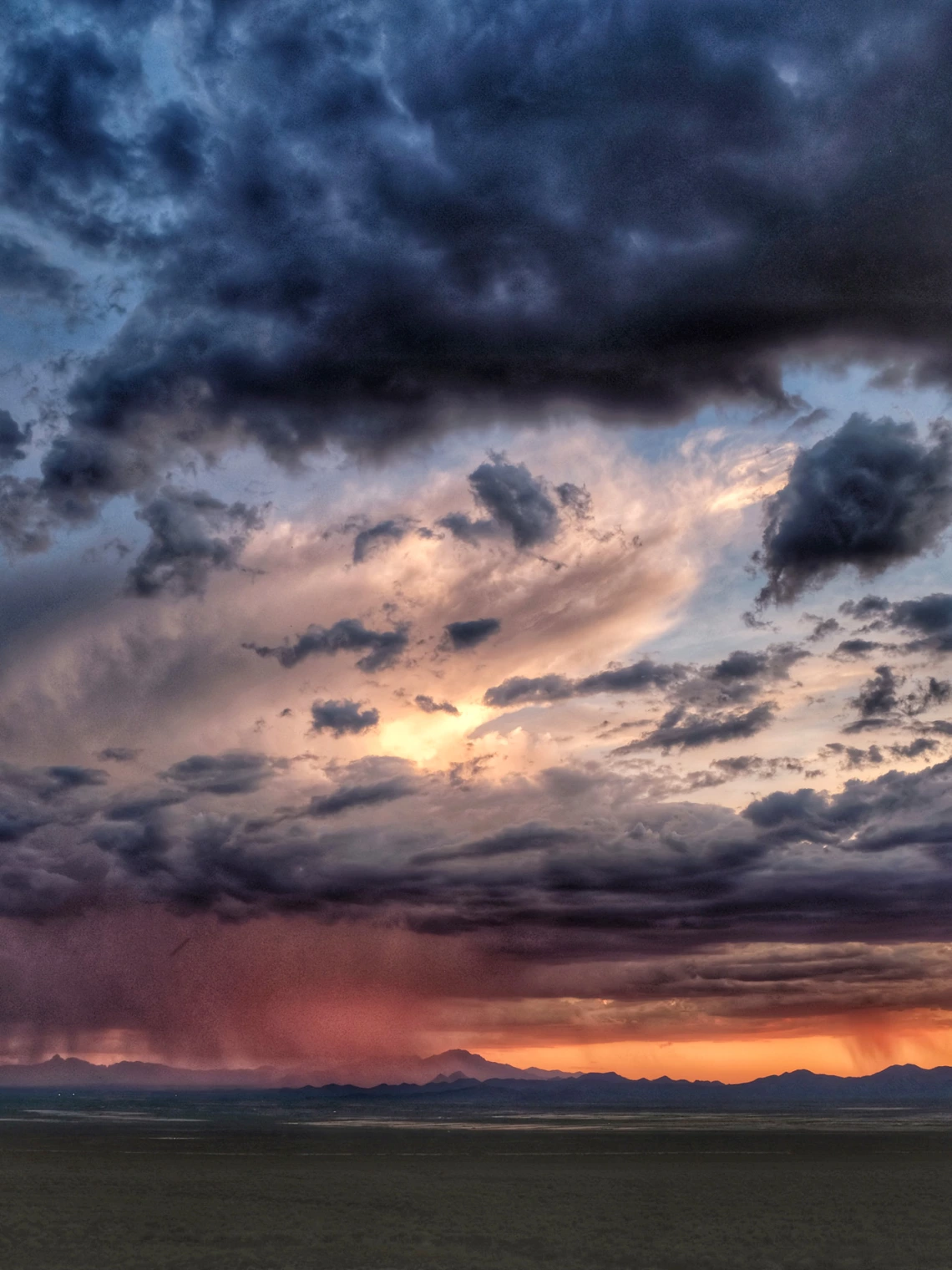 a photo of an arizona sunset with reds and purples