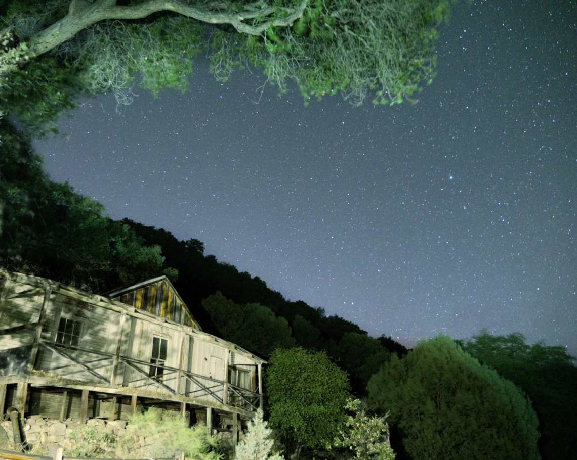 photo showing a cabin at night