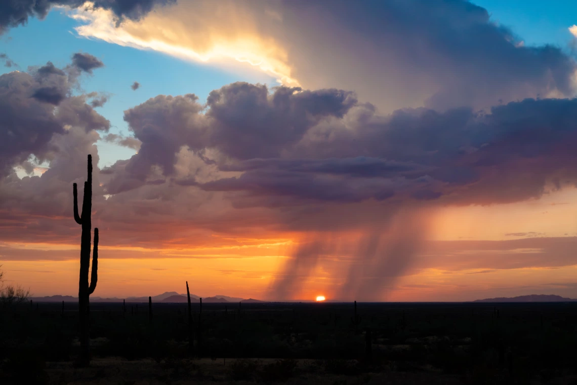 photo showing sunset with rainclouds