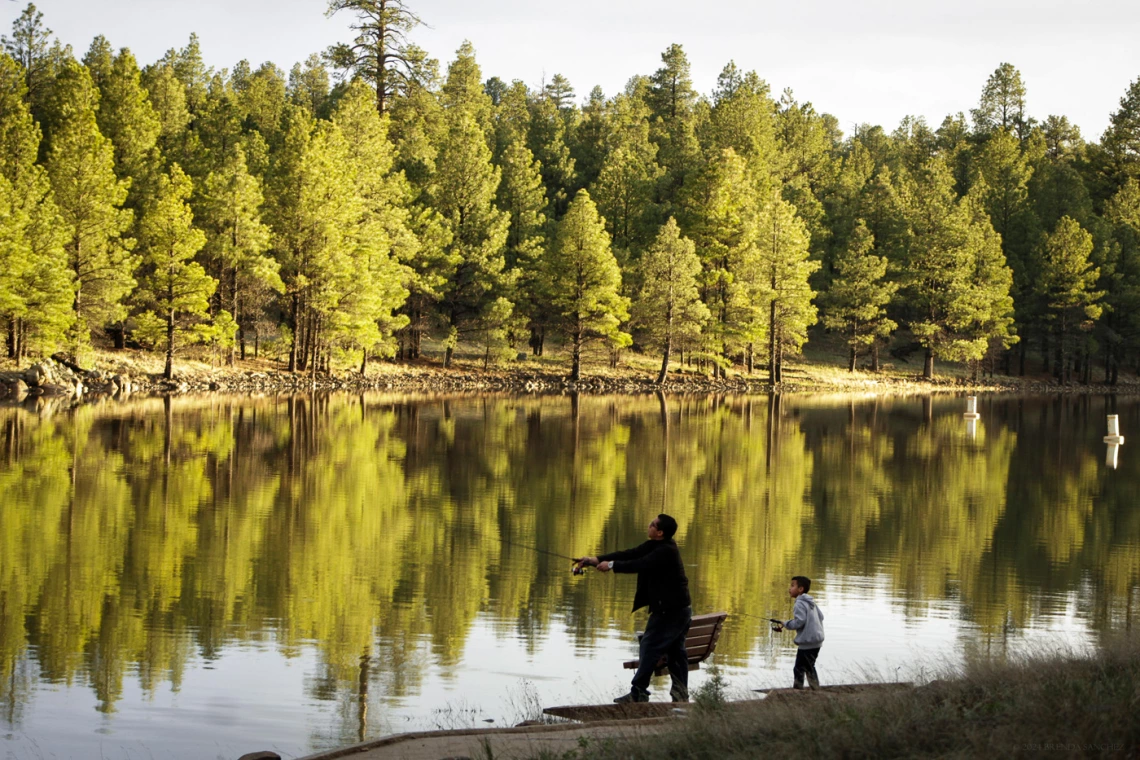 photo of an adult and a child fishing 