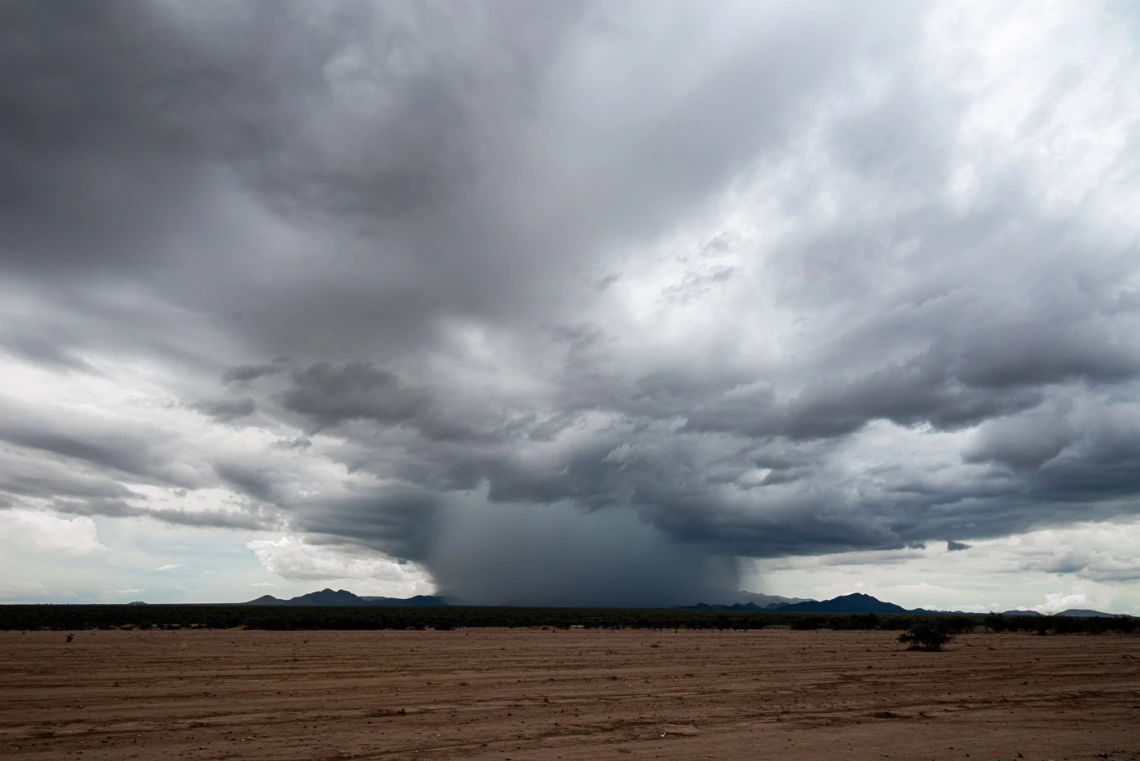 clouds and rain in a field