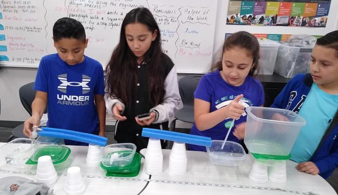 Children doing water experiment