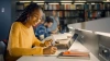 photo of a student at a laptop